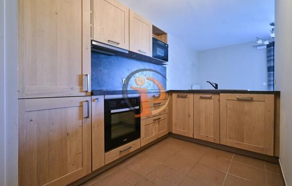 Appartement 2 chambres,  salon séjour,  balcon et garage