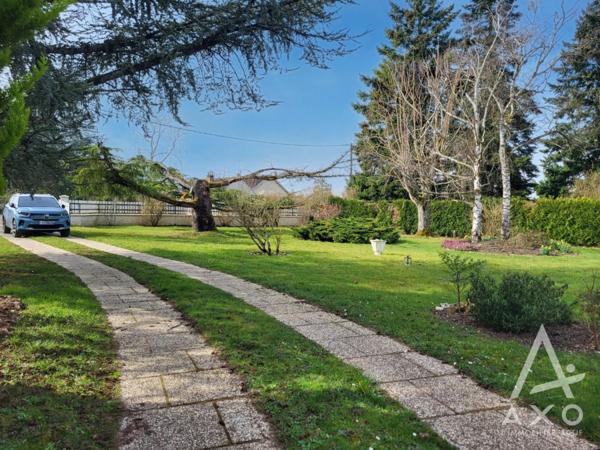 Maison familiale 4 chambres avec véranda et parc paysagé