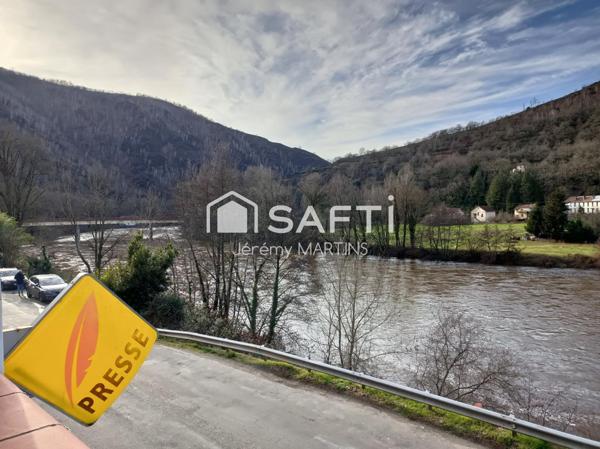 Maison avec local commercial en bord du Lot, idéale pour allier vie et activité professionnelle.