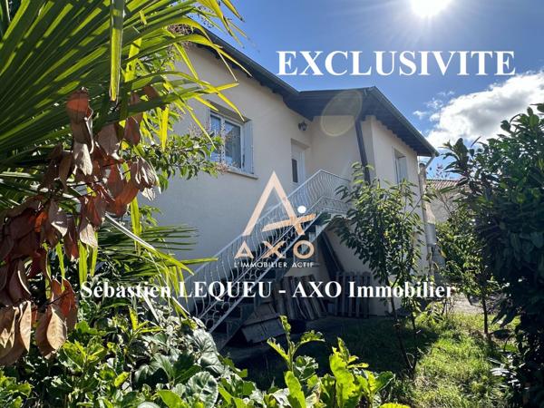 maison de 160 m2 divisée en deux appartements avec garage et jardin