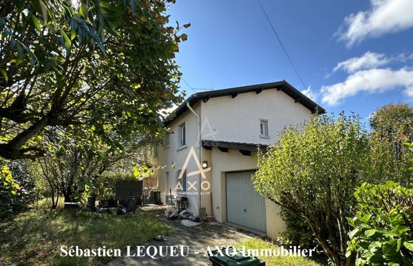 maison de 160 m2 divisée en deux appartements avec garage et jardin