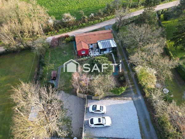 Maison de campagne calme, 2 chambres, dressing, véranda et jardin arboré.