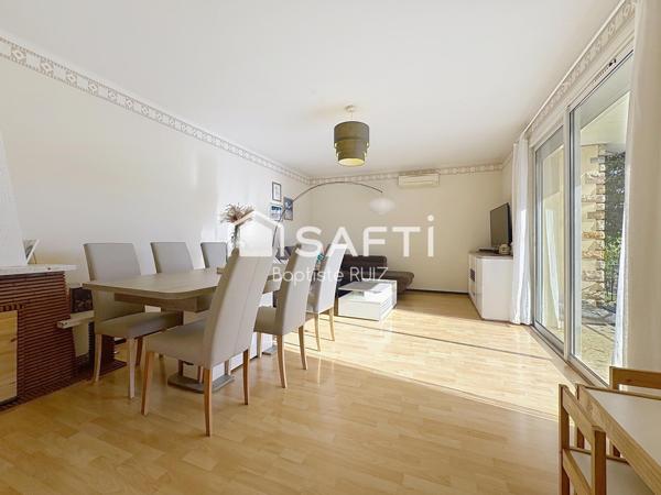 Maison familiale de 98 m² avec jardin arboré.