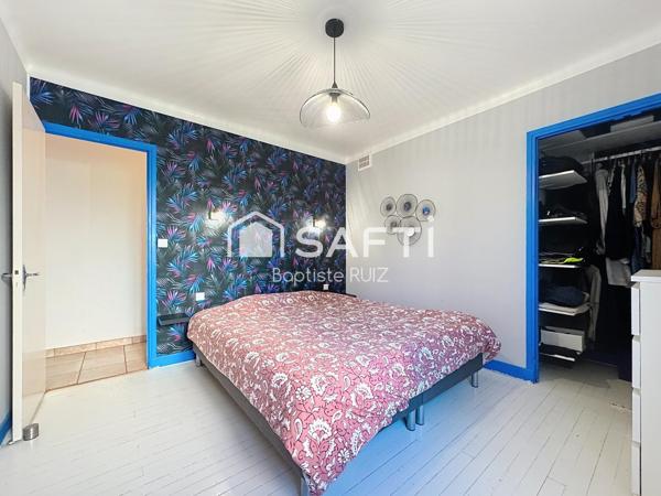 Maison familiale de 98 m² avec jardin arboré.