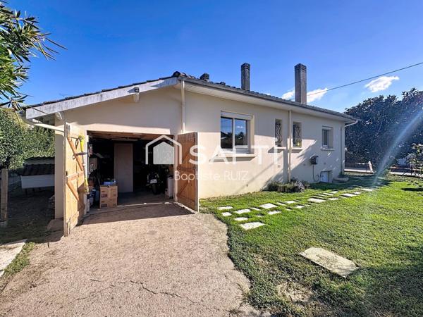 Maison familiale de 98 m² avec jardin arboré.