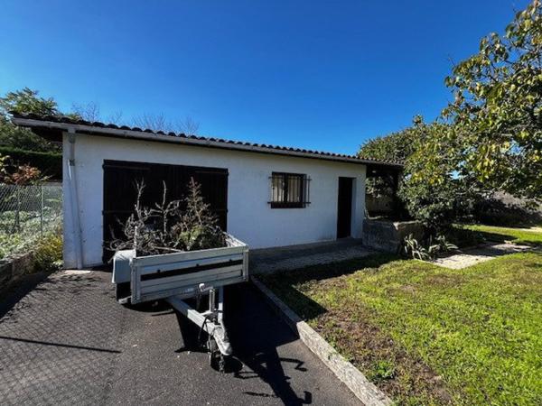 Maison 90m², 4 chambres, grand garage, terrain 582m²