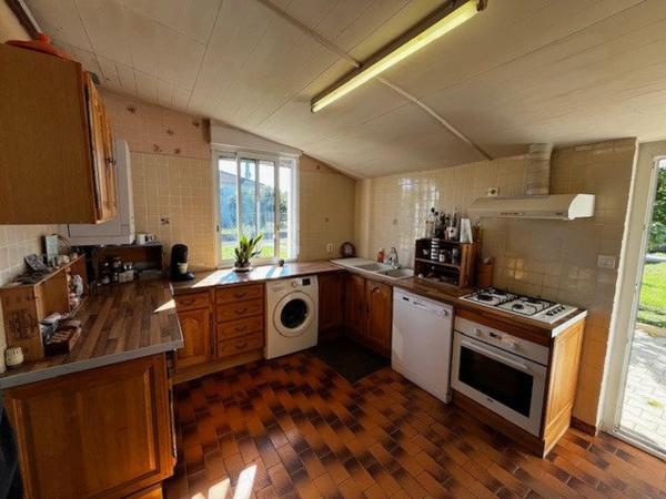 Maison 90m², 4 chambres, grand garage, terrain 582m²