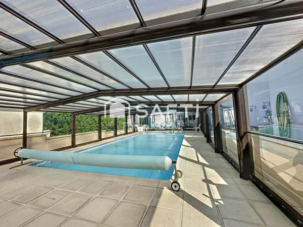 Maison de plain-pied atypique dans son écrin de verdure