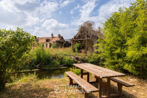 Ancien moulin à blé converti en atelier et maison rénovée