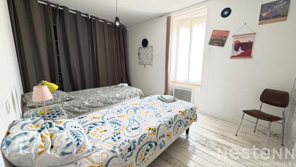 Appartement de charme avec poutres apparentes et 3 chambres en centre-ville - Rare sur le marché