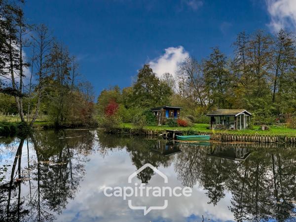 🌿 Terrain de loisirs avec étang – 11 110 m² – Maigné