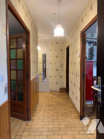 Maison de plain-pied de 72m² avec jardin et garage.