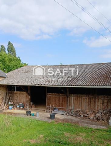 Belle propriété avec une maison des années 1950 et une longère aménagée en loft. Dépendances  avec boxes et plan d'eau et 1 hectare 7 de terrain