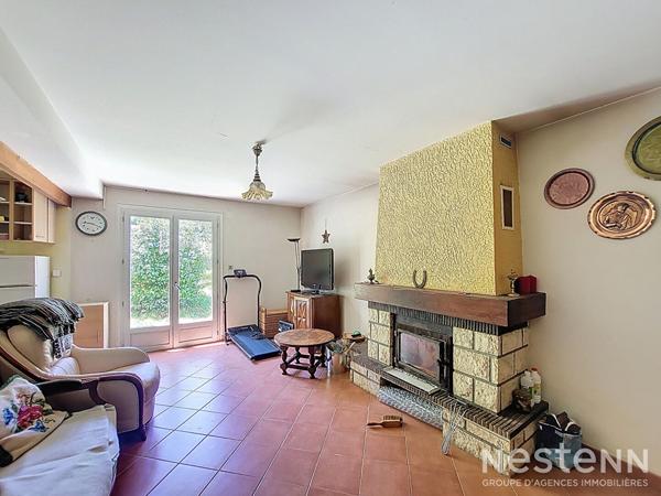 A Vendre Maison des années 1960 de 133 m² sur sous-sol avec jardin et garage de 64 m²