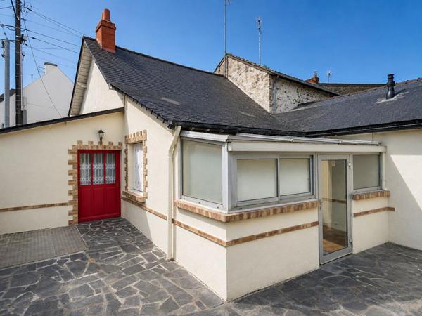 Maison avec jardin et 2 garages