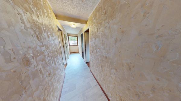 Maison avec potentiel et cadre verdoyant