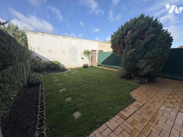 Une maison mitoyenne de 89 m² avec jardin et garage, quartier Bourg/ Centre-Ville