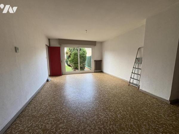 Une maison mitoyenne de 89 m² avec jardin et garage, quartier Bourg/ Centre-Ville