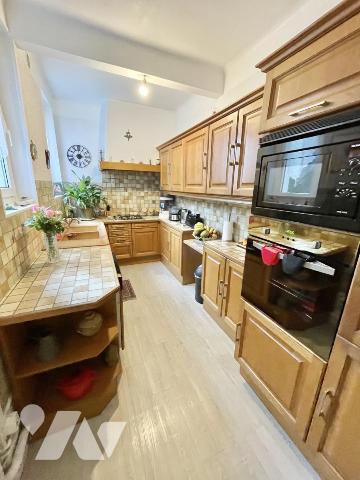 Maison 4 pièces avec jardin et garage.