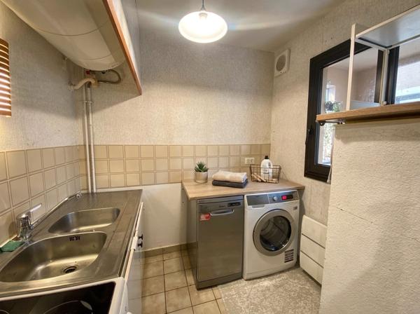 Appartement + stationnement + cave