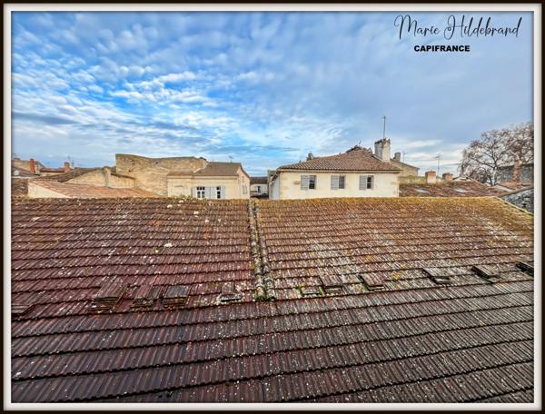 Immeuble de 130m² habitable - 2 appartements - cours