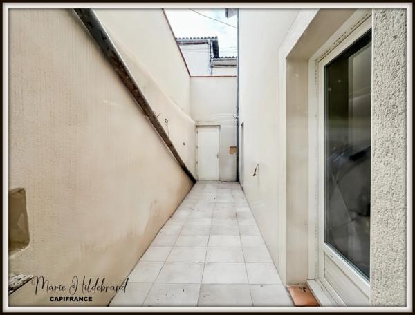 Immeuble de 130m² habitable - 2 appartements - cours