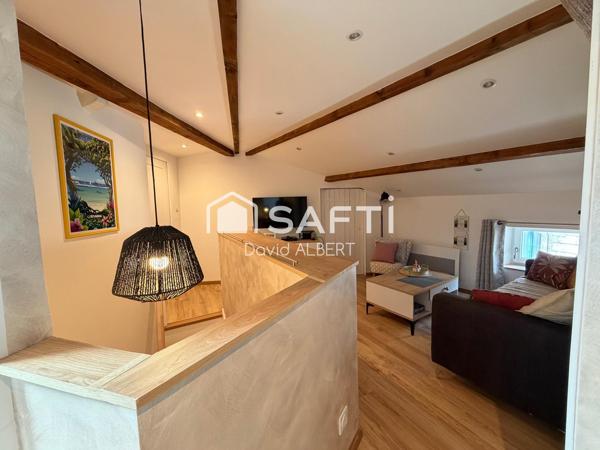 Duplex de caractère avec garage à deux pas du centre ville .
