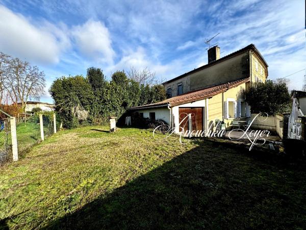 Maison de ville avec garage et jardin