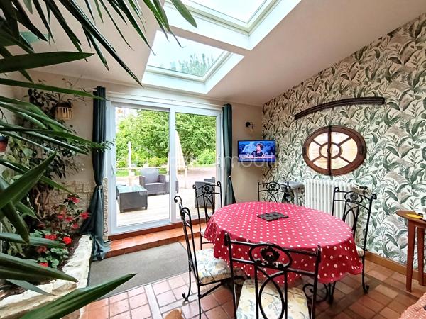 Dans un environnement calme et verdoyant, découvrez cette propriété pleine de charme développant 229 m² environ habitables, composée d'une maison principale de 170 m² environ et d'un gîte indépendant de 59 m² environ, sur un magnifique terrain arboré de 2 335 m².

La maison principale ( 170 m²)
Cette belle maison de caractère allie authenticité, confort et excellentes performances énergétiques.

Rez-de-chaussée:
Entrée ;
Grande cuisine aménagée et équipée avec espace repas ;
Salle à manger ;
Salon chaleureux avec poêle à bois et espace bar ;
Chambre ;
WC indépendant.

Premier étage:
Suite parentale ;
Chambre avec placard ;
Bureau avec toilette
Salle de bains.

Deuxième étage
Chambre ;
Pièce annexe actuellement utilisée en dressing.

Le gîte indépendant (59 m²)
Parfait pour accueillir famille et amis ou développer une activité de location touristique.

Il comprend :
Séjour - salle à manger ;
Cuisine ;
WC indépendant.
Etage
Chambre ;
Salle de bains ;

Les extérieurs
Implantée sur un superbe terrain arboré de 2 335 m², la propriété bénéficie d'un cadre privilégié.
Vous profiterez notamment :
D'une terrasse attenante à la maison ;
D'une seconde terrasse de 40 m² ;
D'une dépendance d'environ 30 m² ;
D'un puits équipé d'un système de pompe ;
De nombreux espaces verts propices à la détente.
Prestations et confort

Maison principale
Classe énergétique A, un atout extrêmement rare pour une maison de caractère ;
Pompe à chaleur ;
Ballon thermodynamique ;
Double vitrage ;
Tout-à-l'égout ;
Poêle à bois.

Gîte
Classe énergétique E.

Les atouts
✔ Excellent DPE : Maison classée A
✔ Gîte indépendant de 59 m²
✔ Terrain arboré de 2 335 m²
✔ Deux terrasses dont une de 40 m²
✔ Dépendance de 30 m²
✔ Puits avec pompe
✔ Chambre au rez-de-chaussée
✔ Idéal projet familial, touristique ou activité de gîte
Une propriété de caractère offrant un cadre de vie exceptionnel, des prestations énergétiques remarquables et un fort potentiel d'exploitation grâce à son gîte indépendant.

A VISITER RAPIDEMENT!