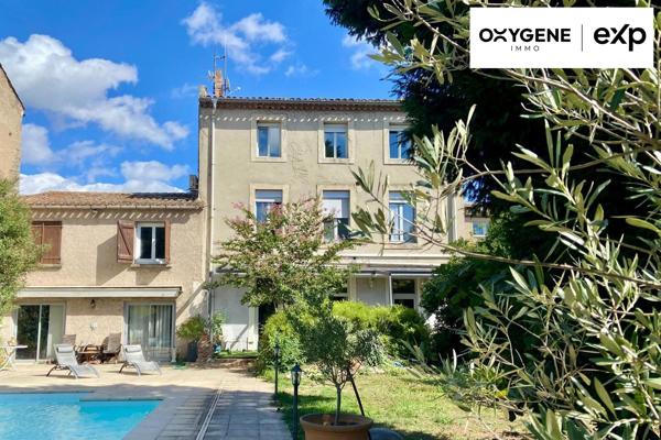 Grande maison de caractère avec dépendances et jardin.