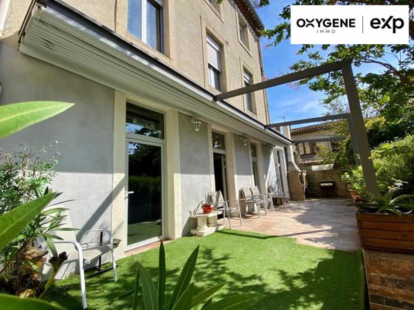Grande maison de caractère avec dépendances et jardin.