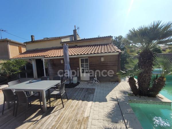 Dpt Gironde (33), à vendre CASTELNAU DE MEDOC maison de 137 m2 avec jardin intime et piscine