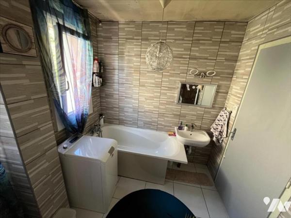 Maison à usage mixte de commerce et d'habitation de 5 pièces (environ 165 m²) située à proximité de