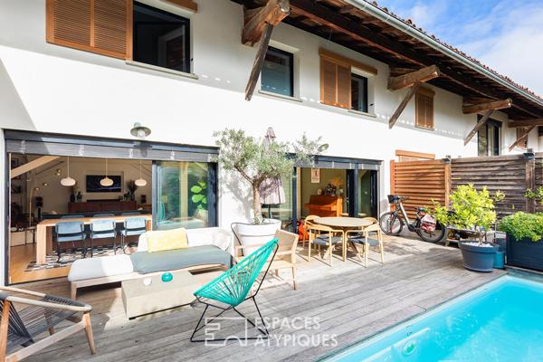 Maison contemporaine réhabilitée dans une ancienne fabrique bas Côté Pavée