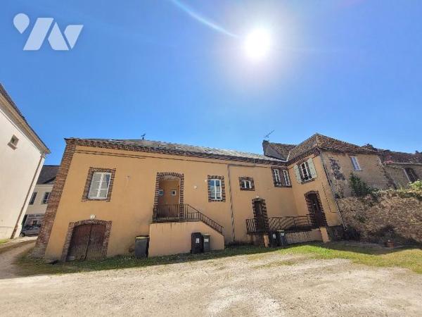 Immeuble avec 5 logements et jardin