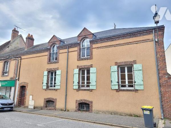 Immeuble avec 5 logements et jardin