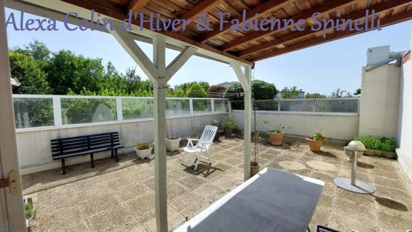 F3 en résidence de standing avec terrasse de 54m2 et pergola