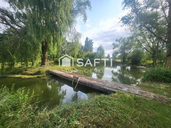 Maison de caractère 223 m² avec étang et presqu’île sur 1,3 ha arboré