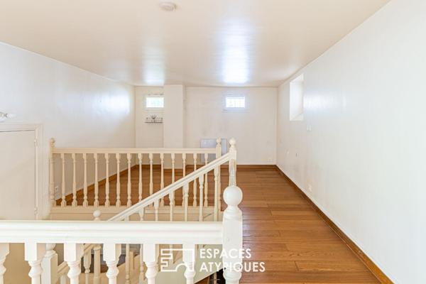 Duplex inversé en cour anglaise arborée, au coeur de l’île de la Jatte.