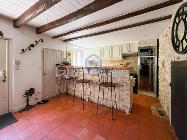 Venez découvrir cette authentique maison en pierre pleine de charme à proximité des écoles, commerces et commodités à pied.
Elle offre un séjour chaleureux avec poutres apparentes et cheminée ouvert sur sur une cuisine aménagée et équipée avec un accès à une cave voutée. 
A l'étage une suite parentale avec dressing et salle d'eau avec wc, trois chambres, salle de bain avec douche et wc, et palier faisant office d'un coin de lecture ou bureau.
Grenier aménageable.
A l'extérieur vous profiterez d'un jardin sur plusieurs niveaux qui fait son charme avec une grande terrasse, arbres fruitiers et bassins, idéal pour les moments de détente.
La propriété dispose également d'un grand garage, d'un atelier, de trois petites dépendances offrant de nombreuses possibilités. A voir très vite !!!