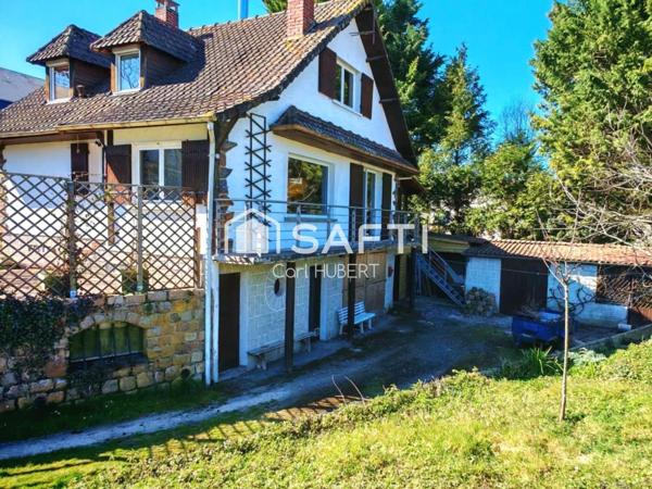 Maison avec garage et jardin