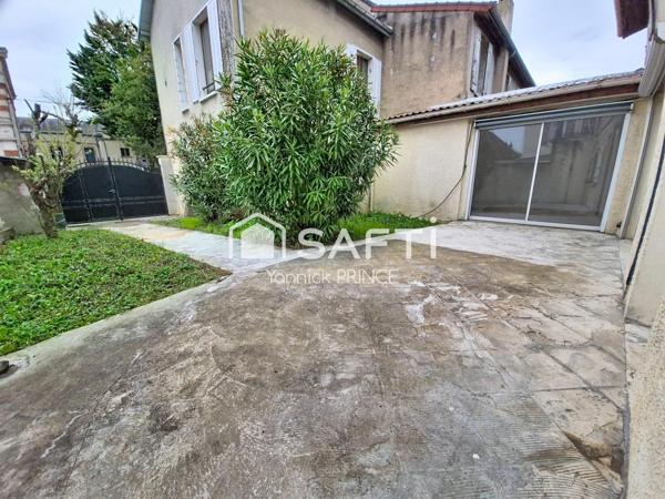 Maison de ville avec jardin, proche coeur de ville