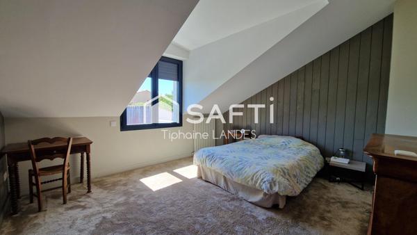 Belle maison spacieuse avec 4 chambres et jardin.
