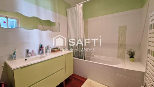 Belle maison spacieuse avec 4 chambres et jardin.