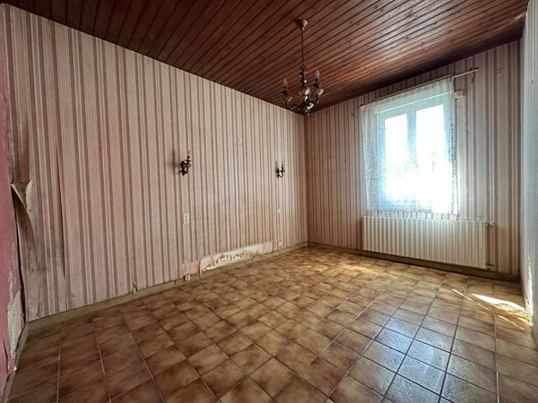 Maison de 107m² à rénover à Vannes Ouest avec jardin, garage et véranda proche commodités