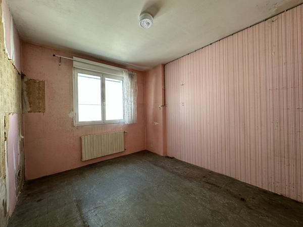 Maison de 107m² à rénover à Vannes Ouest avec jardin, garage et véranda proche commodités