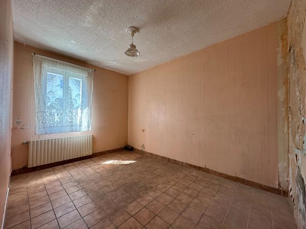 Maison de 107m² à rénover à Vannes Ouest avec jardin, garage et véranda proche commodités