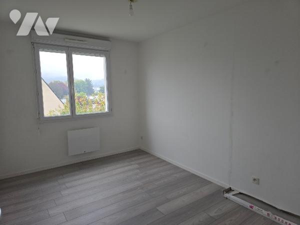 Dans un ensemble immobilier situé à PONT-AUDEMER (EURE)