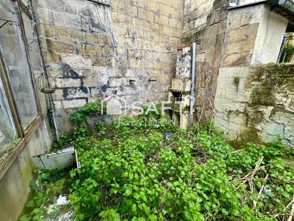 Immeuble 200 m2 Un local commercial + 2 Appartements +