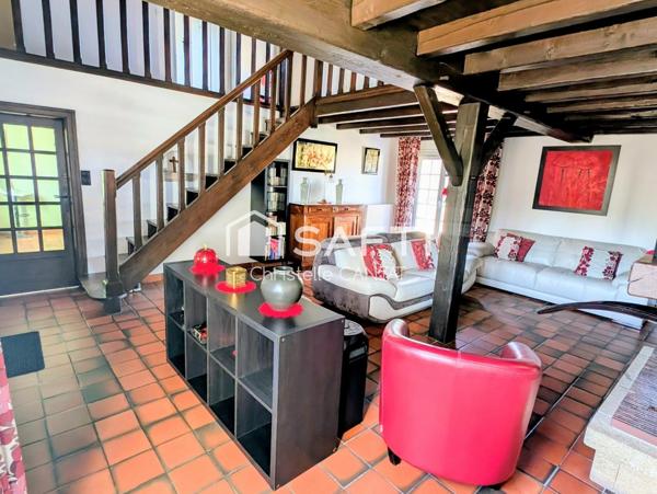 Maison 138 m², 4 chambres, 2 garages et terrasse.